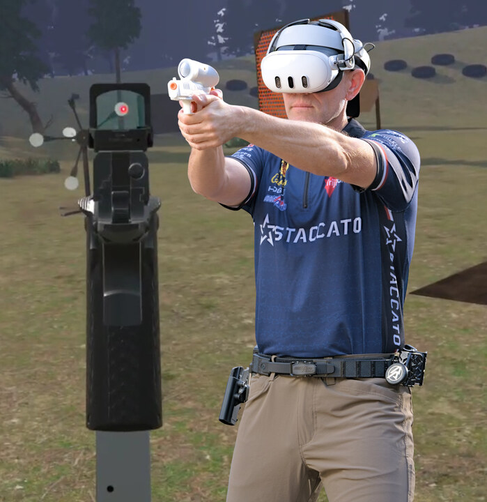 A shooter in a Quest headset aiming a tracked pistol at a steel target on a virtual range
